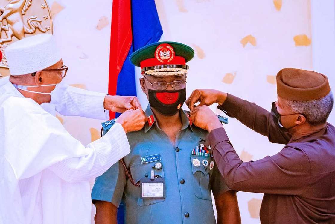 Buhari and Osinbajo decorating COAS Yahaya Buhari and Osinbajo decorating COAS Yahaya