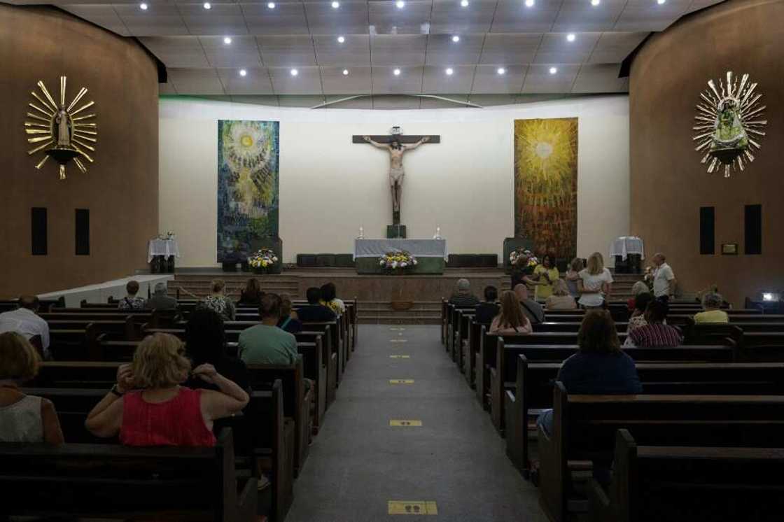 People pray at Nossa Senhora de Copacabana church, in Copacabana, Rio de Janeiro, Brazil, on October 30, 2022, during the presidential run-off election People pray at Nossa Senhora de Copacabana church, in Copacabana, Rio de Janeiro, Brazil, on October 30, 2022, during the presidential run-off election