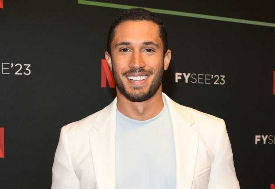 Sean Palmieri posing for a photo in a white outfit Sean Palmieri posing for a photo in a white outfit