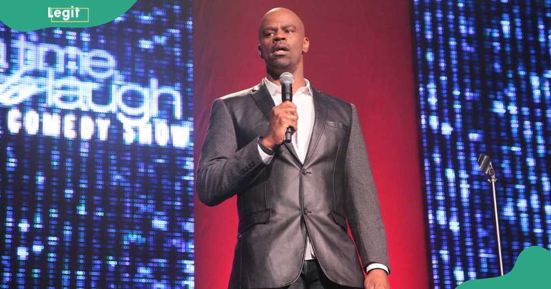 Michael Jr. performs on a stage at A Time To Laugh comedy show