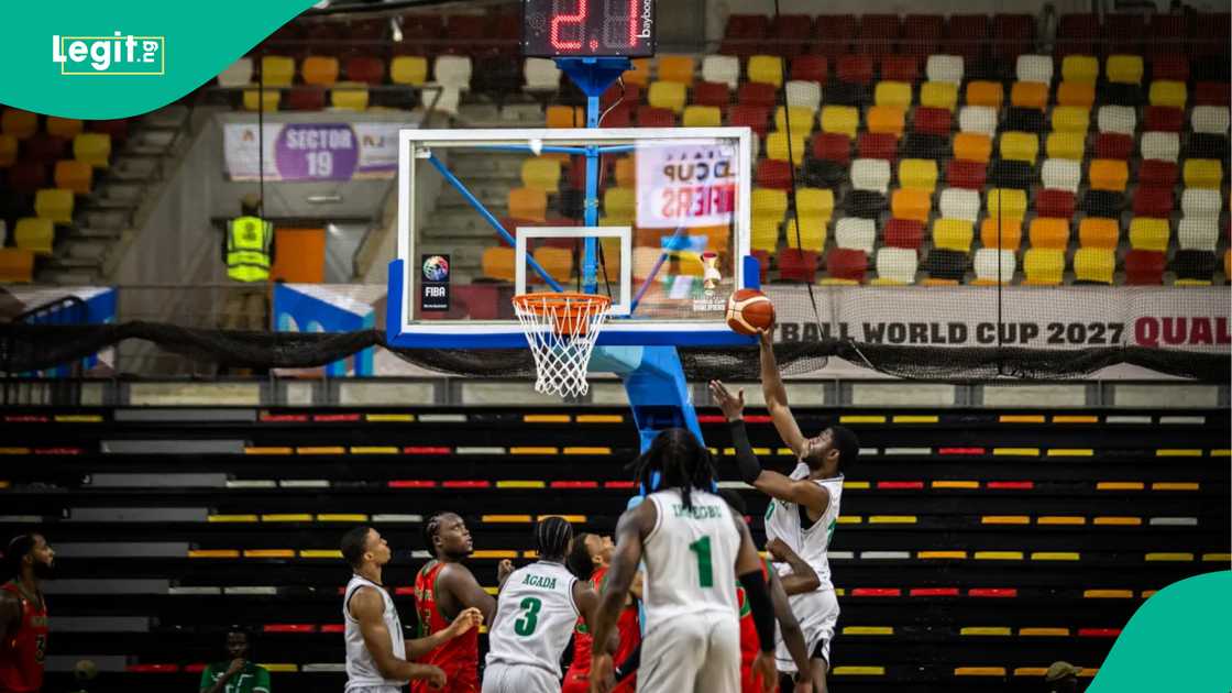 Nigeria's D'Tigers making an offensive move against Guinea. Photo by FIBA