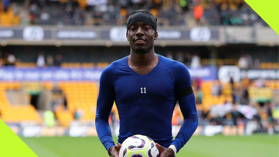 Noni Madueke with his match ball after scoring a hat trick for Chelsea against Wolves.