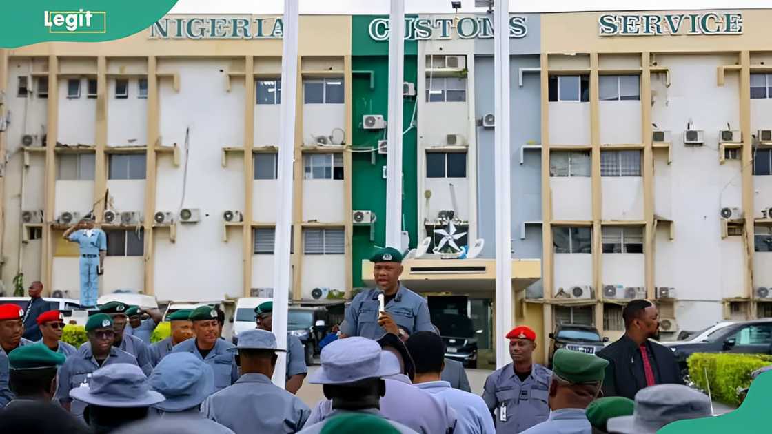 The Nigerian Customs Service (NCS) officers having a meeting outside their offices.