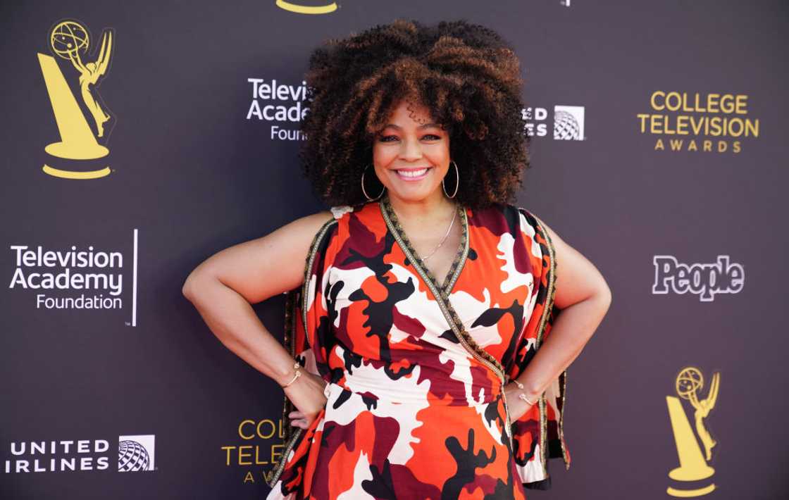 Kim Fields smiling as she poses in a flowery dress at the the 42nd Television Awards