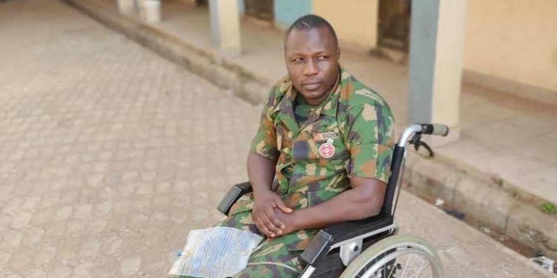 Wounded soldier using wheelchair begs Nigerians for help after suffering spinal cord injury Wounded soldier using wheelchair begs Nigerians for help after suffering spinal cord injury