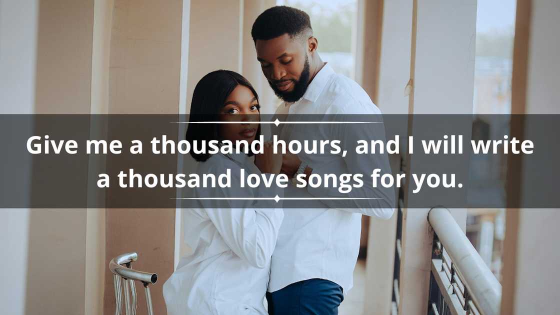 A stylish couple in matching white shirts is holding hands A stylish couple in matching white shirts is holding hands