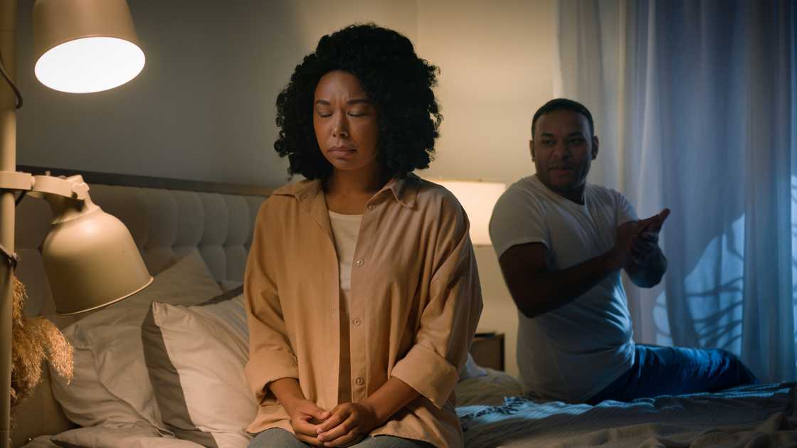 A couple quarrels in the bedroom.