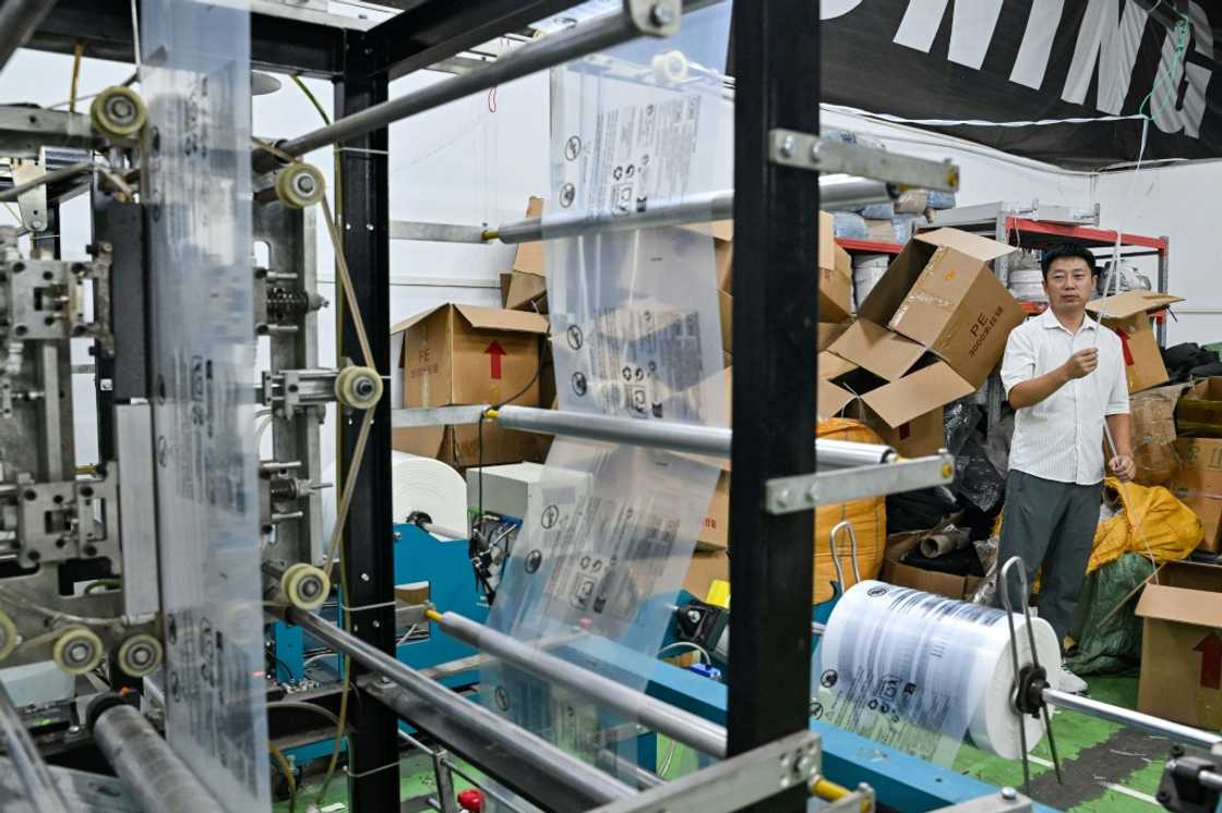 The uncertainty provided opportunity for smaller logistics firms like Weijiang, said manager Chen Weiyan (R), as they have taken the chance to expand their market