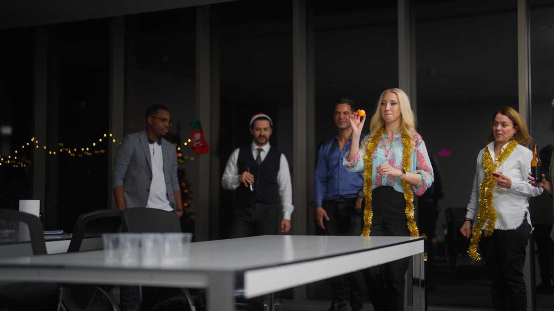 Workmates participate in an office game Workmates participate in an office game