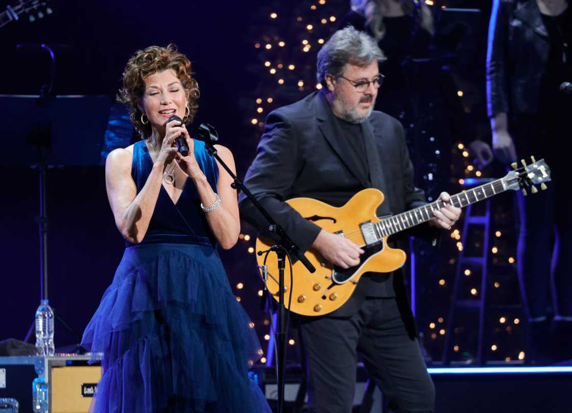 Vince Gill and his wife perform at an event Vince Gill and his wife perform at an event
