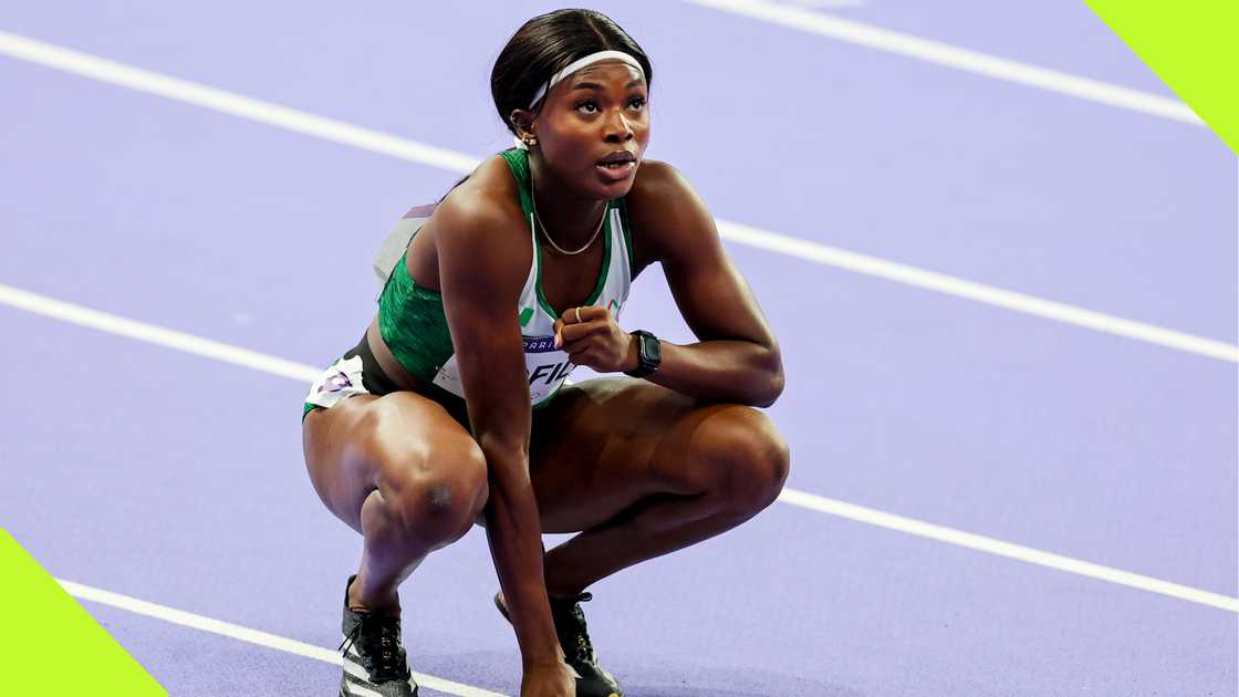 Favour Ofili squats after her Paris 2024 Olympics 200m event.