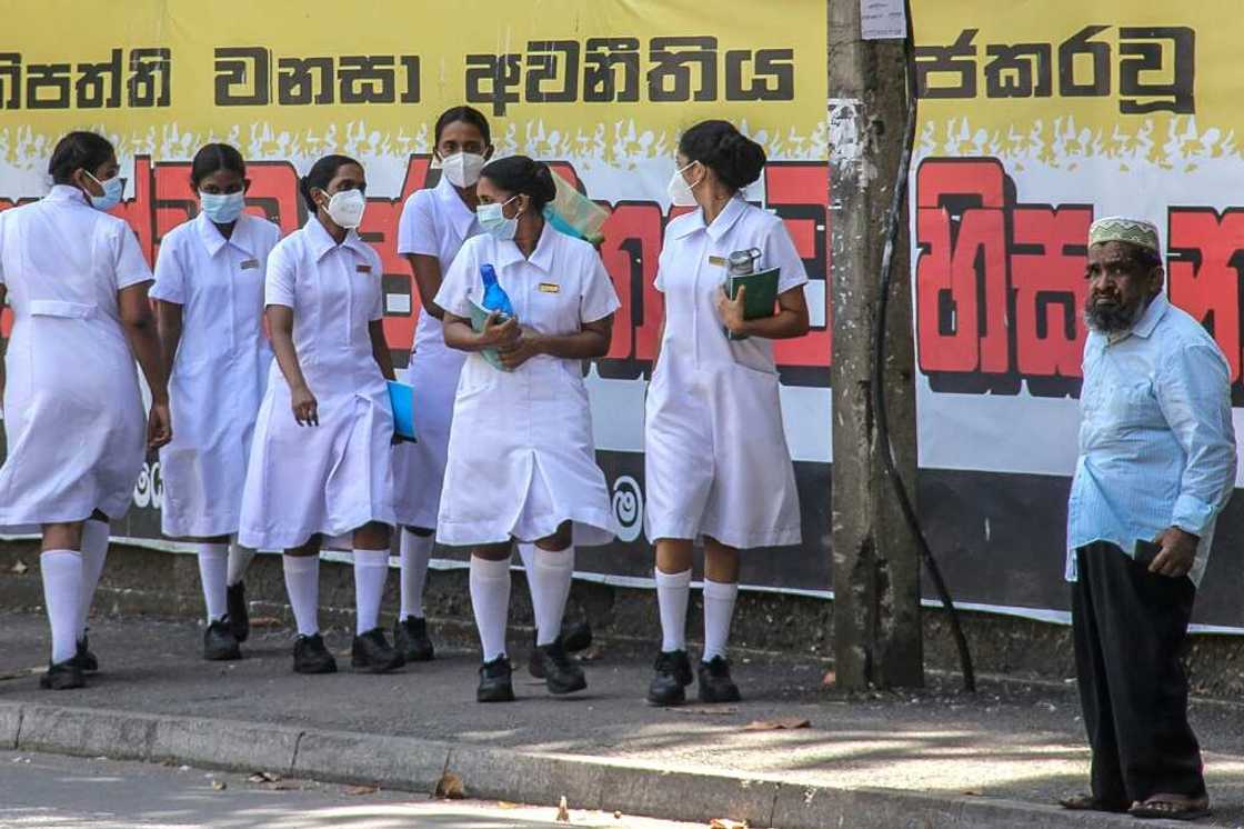 Nurses walk outside the National Hospital in Colombo, where many of its 3,400 beds are lying unused Nurses walk outside the National Hospital in Colombo, where many of its 3,400 beds are lying unused