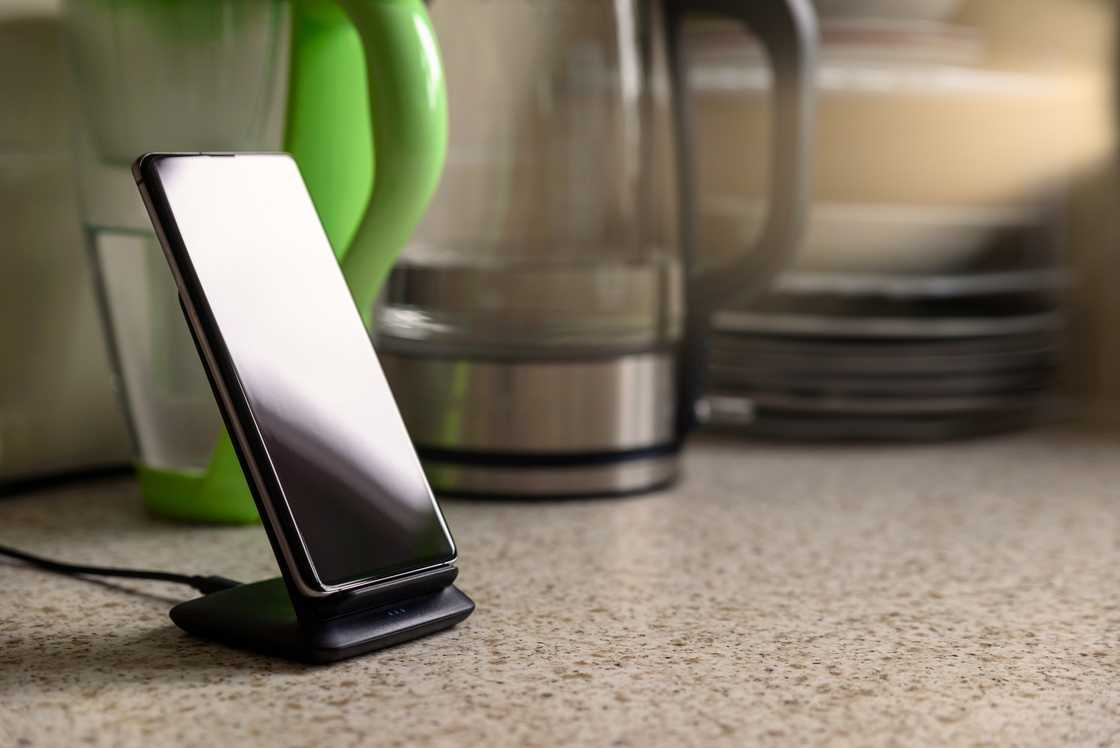 A phone on the kitchen counter