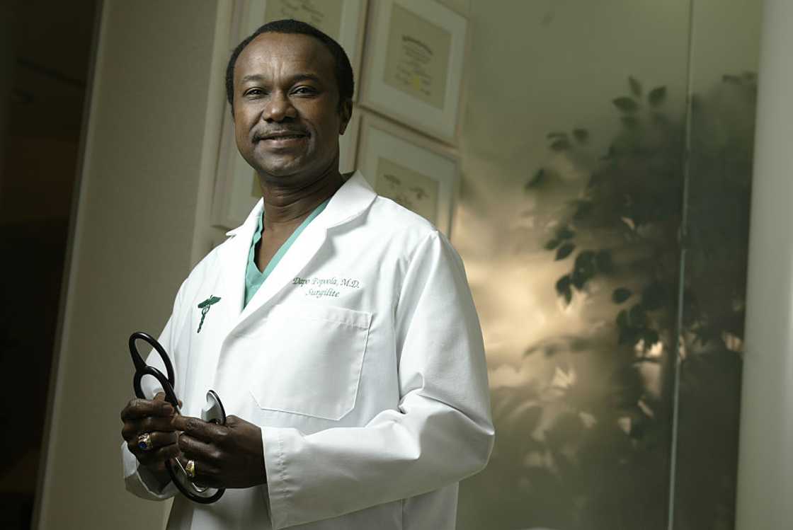 Dr. Dapo Popoola holding stethoscope Dr. Dapo Popoola holding stethoscope