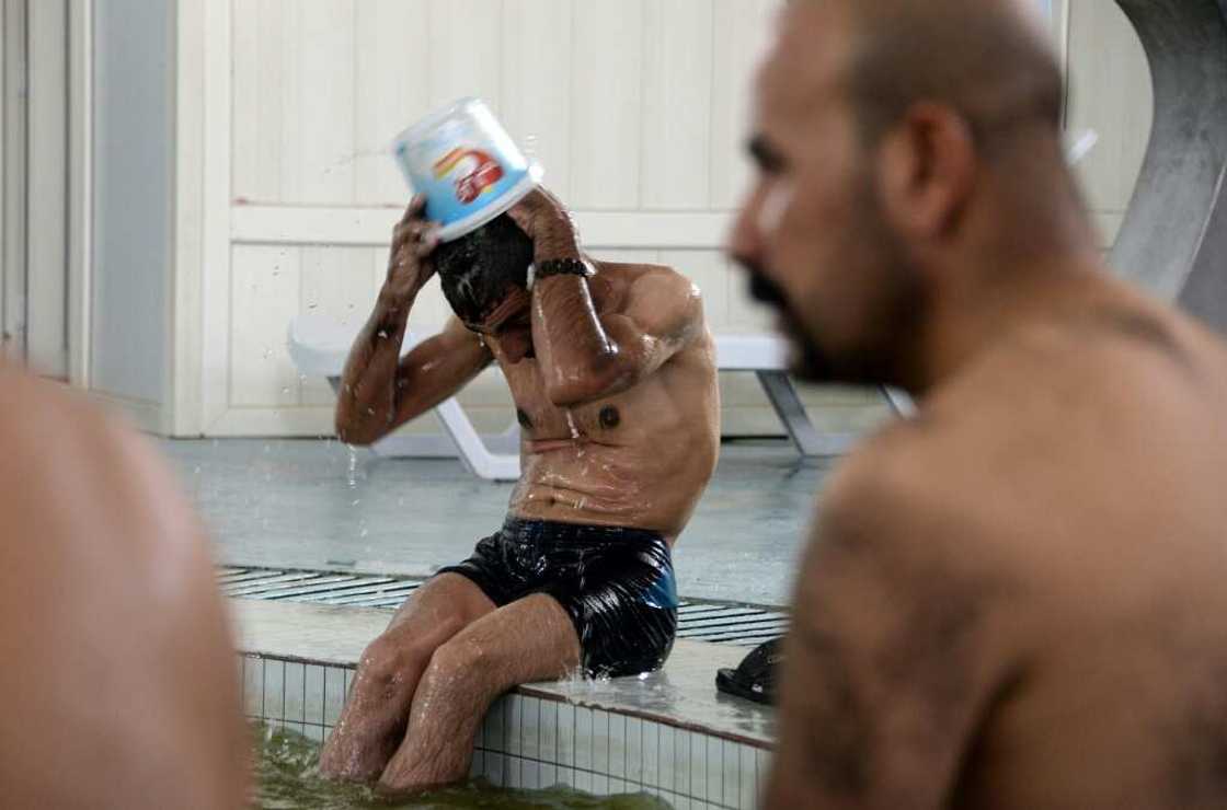 In the Hamam al-Alil baths' newly tiled rooms, men and children enjoy a moment of therapeutic relaxation for 5,000 dinars ($3) In the Hamam al-Alil baths' newly tiled rooms, men and children enjoy a moment of therapeutic relaxation for 5,000 dinars ($3)