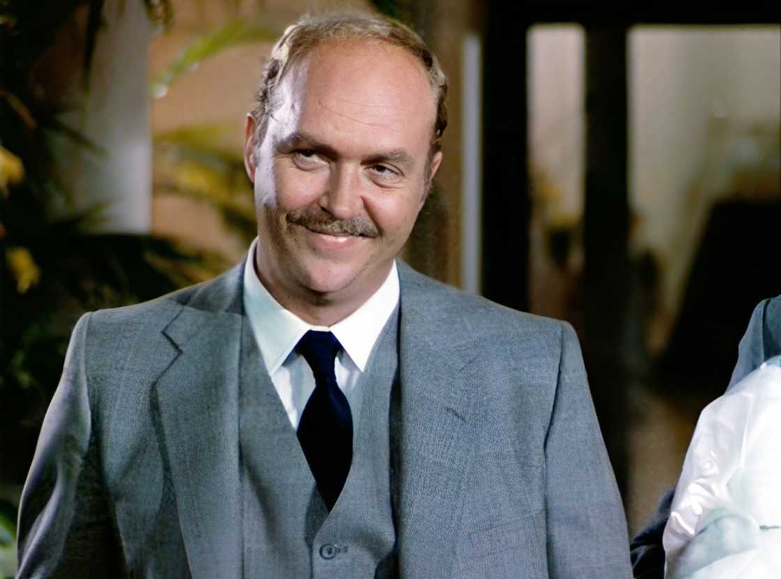 John Ashton smiles in a scene playing Detective Sgt. John Taggart John Ashton smiles in a scene playing Detective Sgt. John Taggart