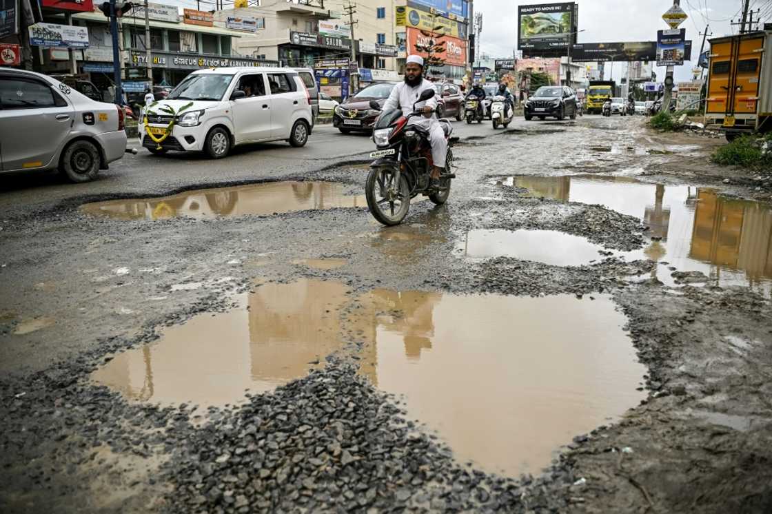 Bengaluru's business district is scarred with potholes and often flooded during the monsoon Bengaluru's business district is scarred with potholes and often flooded during the monsoon