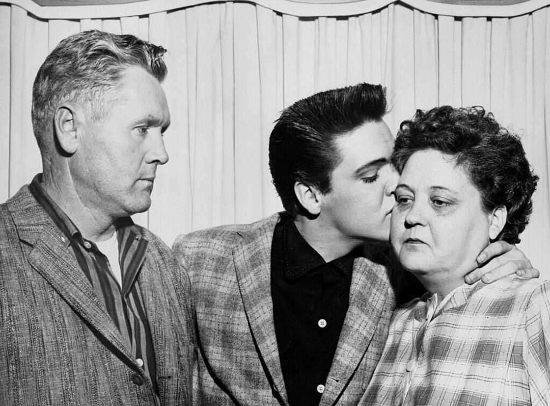 Singer Elvis Presley and his parents on the eve of his induction into the Army Singer Elvis Presley and his parents on the eve of his induction into the Army
