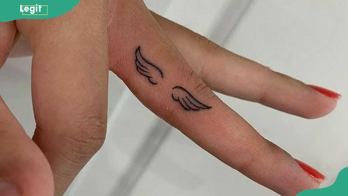 Angel wings wedding ring tattoo