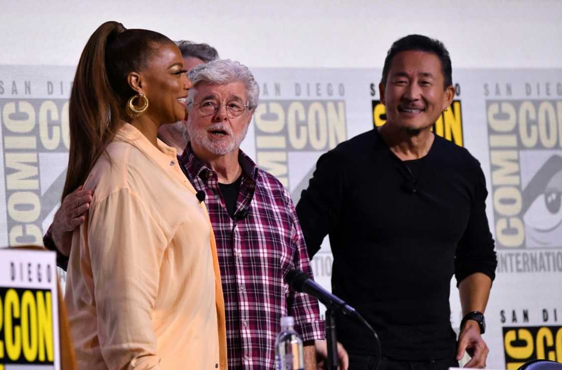Singer and actress Queen Latifah (left) moderated the panel discussion between director George Lucas (center) and production designer Doug Chiang (right) Singer and actress Queen Latifah (left) moderated the panel discussion between director George Lucas (center) and production designer Doug Chiang (right)