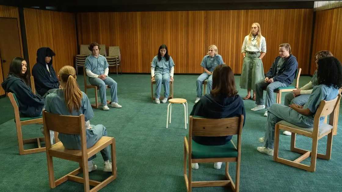 Tall Pines Academy students sit in a circle during a therapy session.