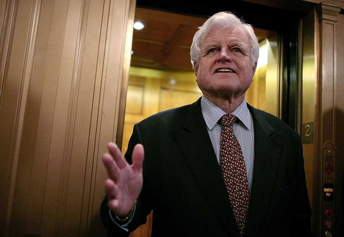 Senator Ted Kennedy talks with the news media