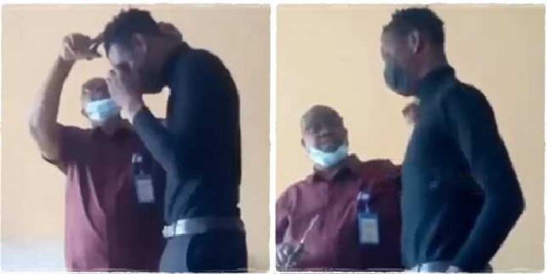 A lecturer at Veritas University, Abuja reportedly seen shaving a student's hair A lecturer at Veritas University, Abuja reportedly seen shaving a student's hair