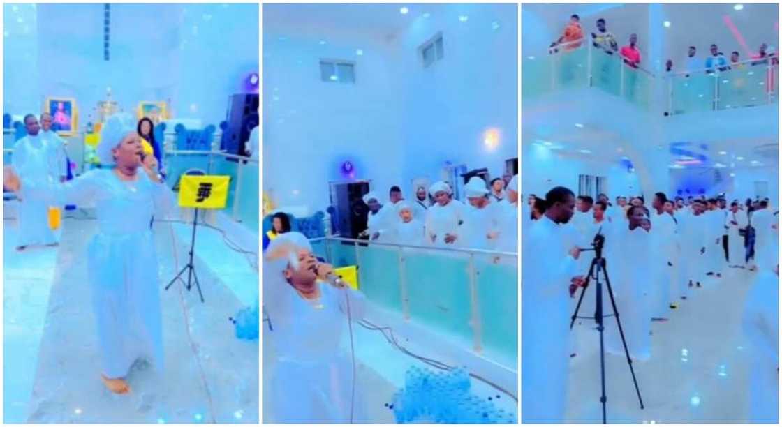 Nigerian church members in white garments sing and dance hard to "Zazu" during church service. Nigerian church members in white garments sing and dance hard to "Zazu" during church service.