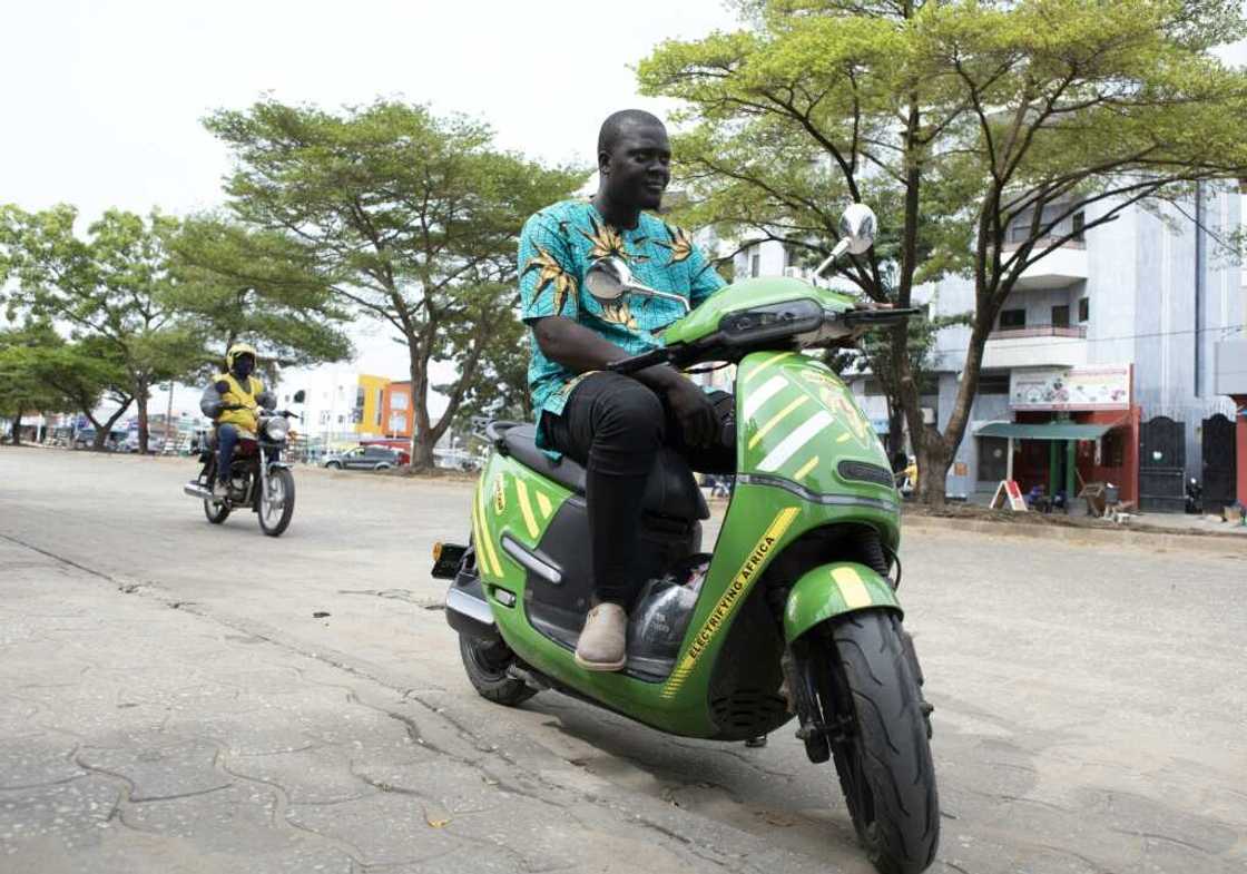 For many drivers in Cotonou, electric motorcycles are more a question of cost than pollution For many drivers in Cotonou, electric motorcycles are more a question of cost than pollution