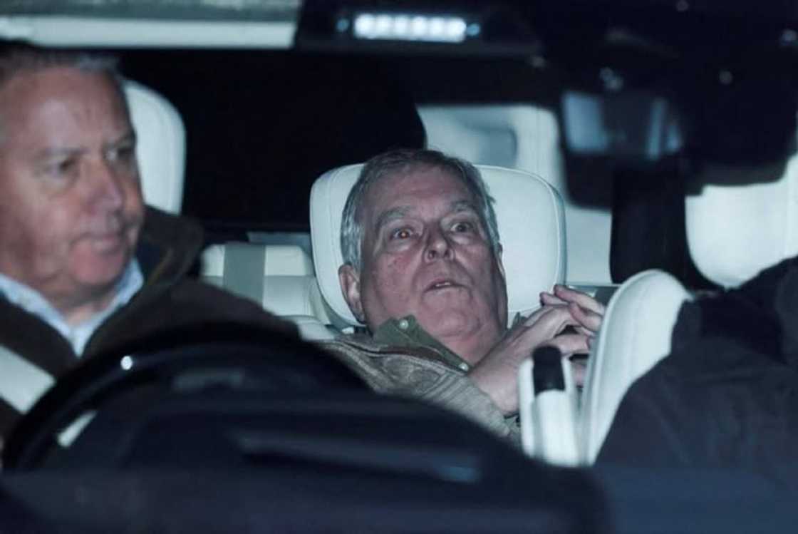 Andrew Mountbatten-Windsor seats leaning back in a car