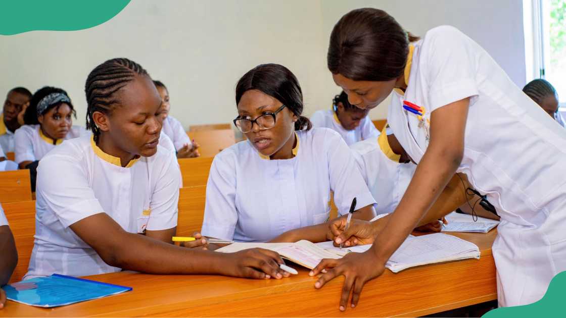 Clifford University nursing students having a discussion in a classroom. Clifford University nursing students having a discussion in a classroom.