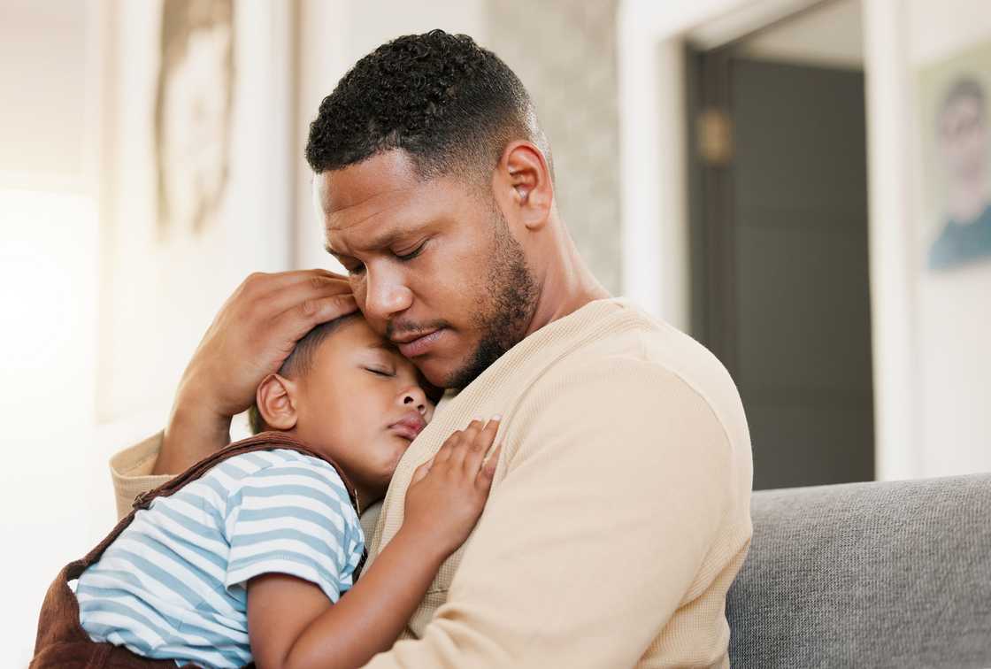A man hoding a boy