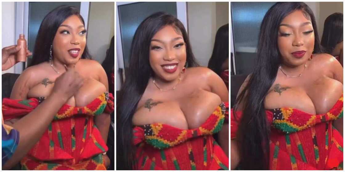 Lady in Kente dress shows off bosoms