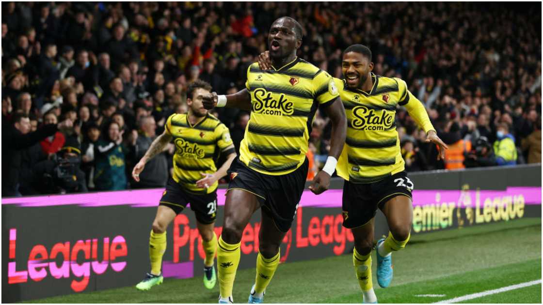 Moussa Sissoko celebrates with teammate Emmanuel Dennis after scoring during the Premier League match between Watford and Crystal Palace at Vicarage Road. Photo by Paul Harding. Moussa Sissoko celebrates with teammate Emmanuel Dennis after scoring during the Premier League match between Watford and Crystal Palace at Vicarage Road. Photo by Paul Harding.