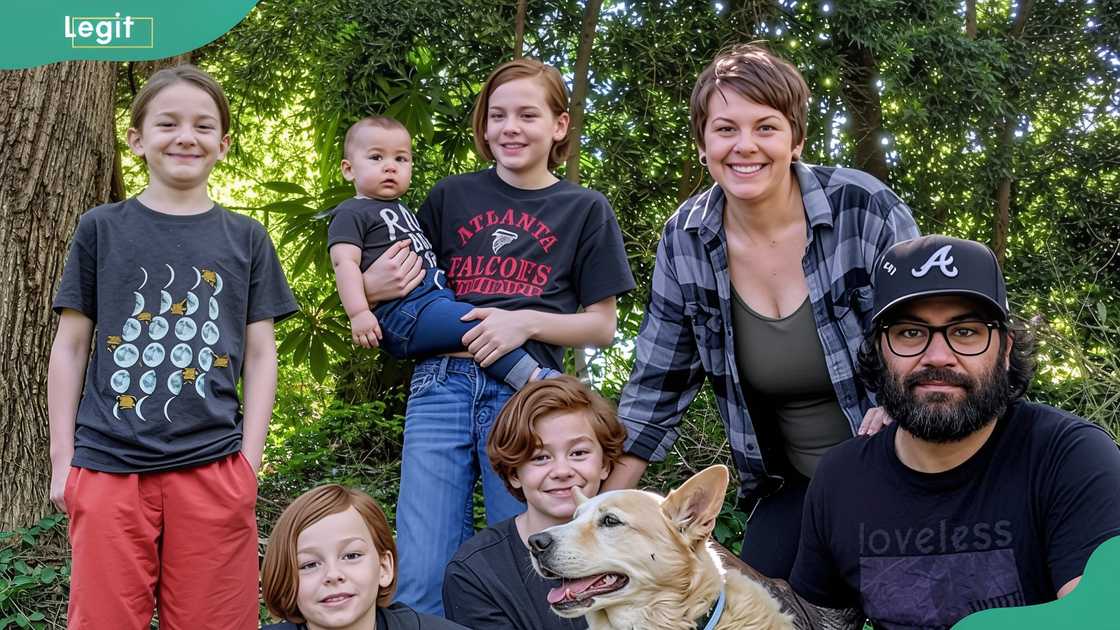 Albert Omstead posing outdoors with his wife and children Albert Omstead posing outdoors with his wife and children