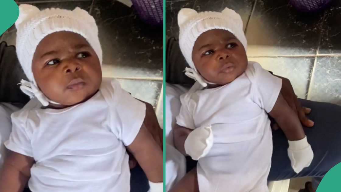 Baby looks at a nurse in a funny way. Baby looks at a nurse in a funny way.