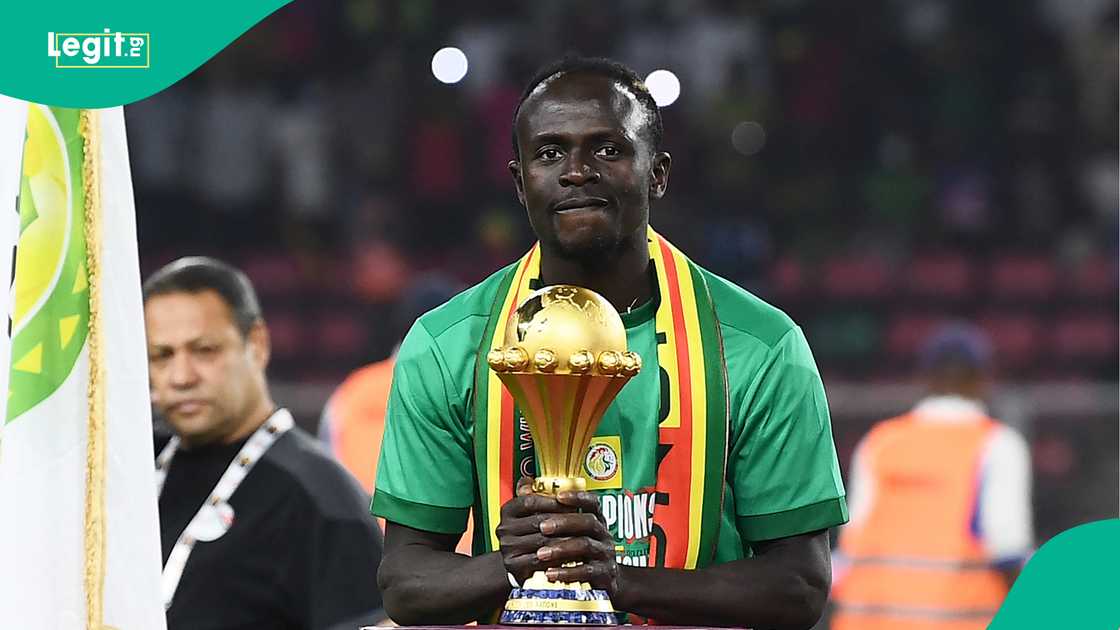 Sadio Mane holds the AFCON trophy after winning the 2021 final against Egypt in Cameroon. Photo by CHARLY TRIBALLEAU Sadio Mane holds the AFCON trophy after winning the 2021 final against Egypt in Cameroon. Photo by CHARLY TRIBALLEAU