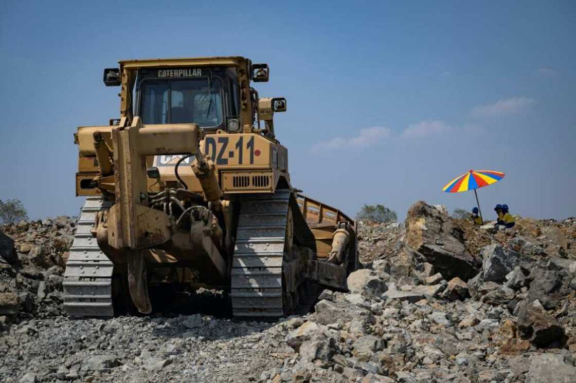 A controversial gold mine in northern Thailand reopens, pouring its first bars more than six years after it was closed over health and environmental concerns