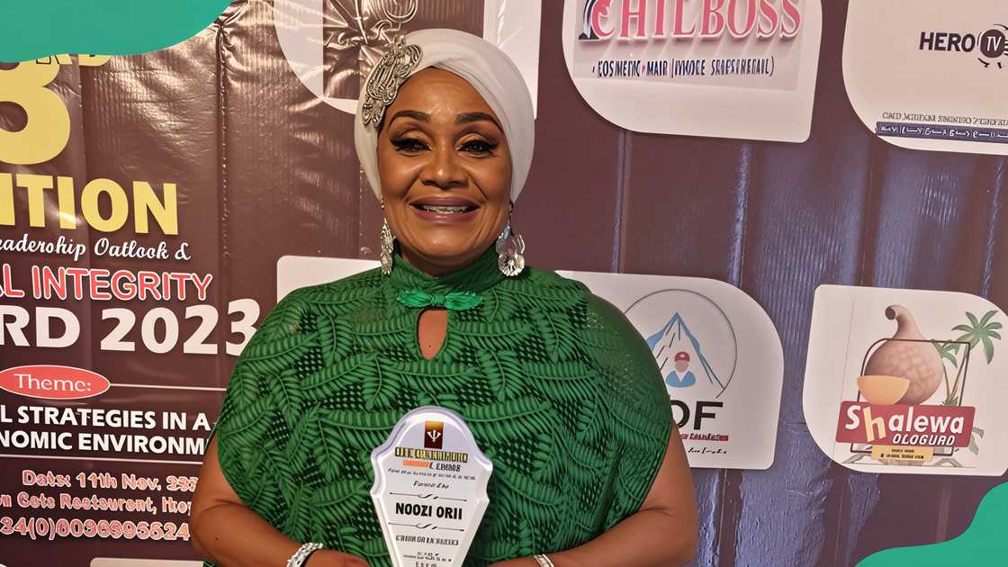 Ngozi Orji holding an award. Ngozi Orji holding an award.