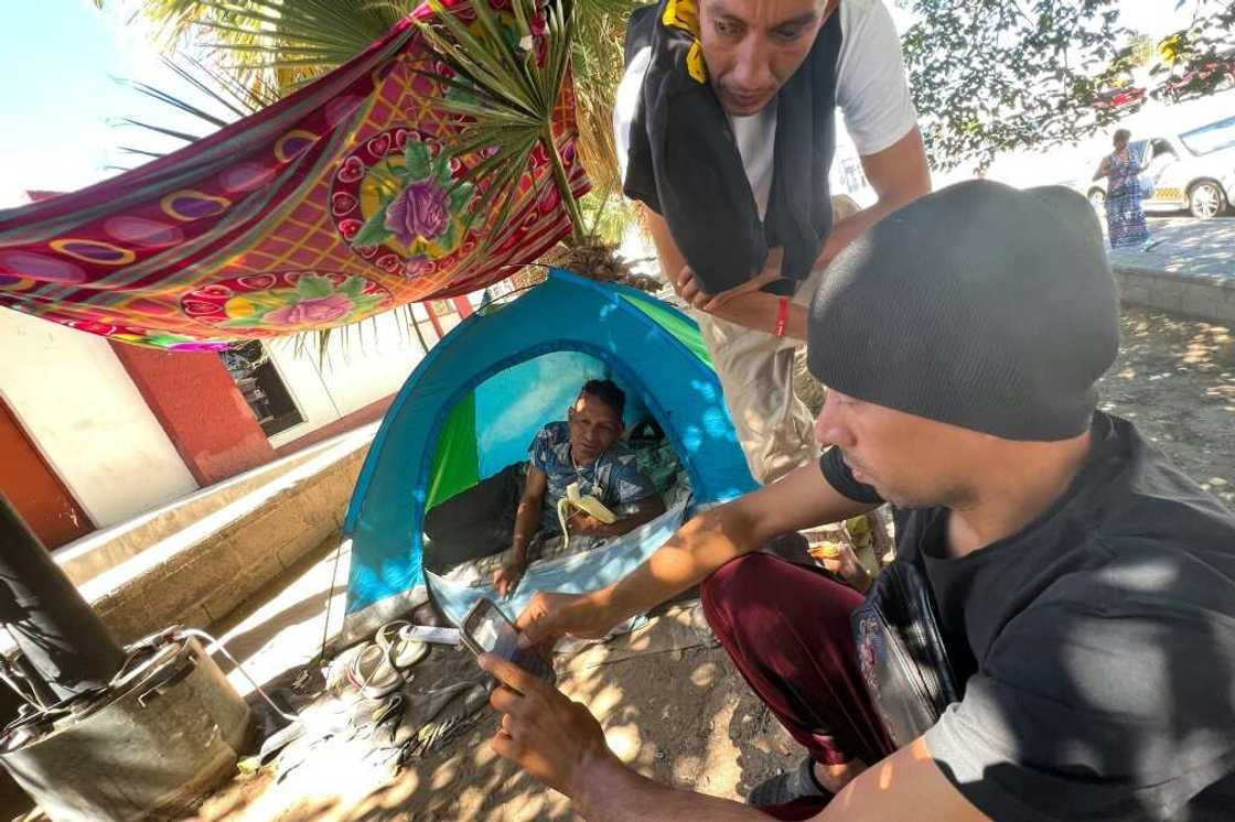 Even finding a place to charge a cell phone is a challenge for many migrants Even finding a place to charge a cell phone is a challenge for many migrants