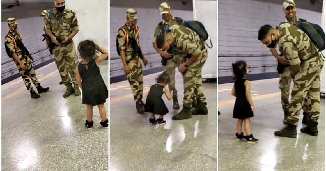 Salute, little girl salutes soldier, touch his feet Salute, little girl salutes soldier, touch his feet