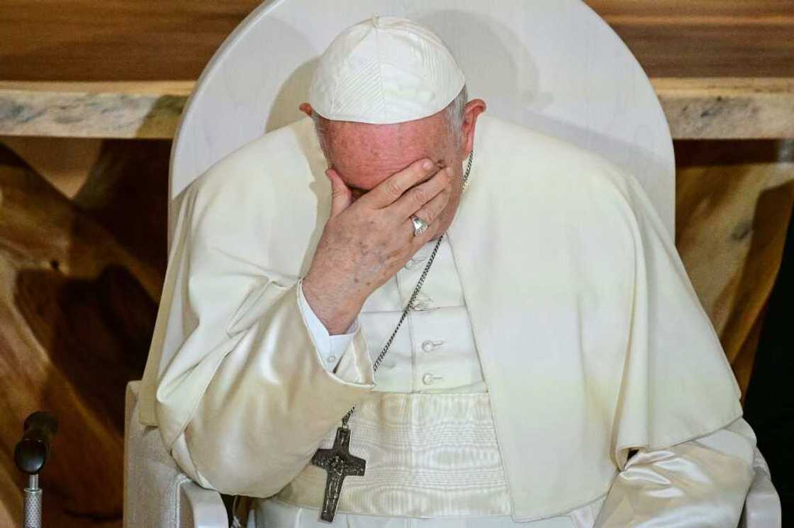 Pope Francis holds his head in his hand during a meeting with members of the Indigenous community at the Sacred Heart Church of the First Peoples in Edmonton, Alberta, Canada, on July 25, 2022 Pope Francis holds his head in his hand during a meeting with members of the Indigenous community at the Sacred Heart Church of the First Peoples in Edmonton, Alberta, Canada, on July 25, 2022