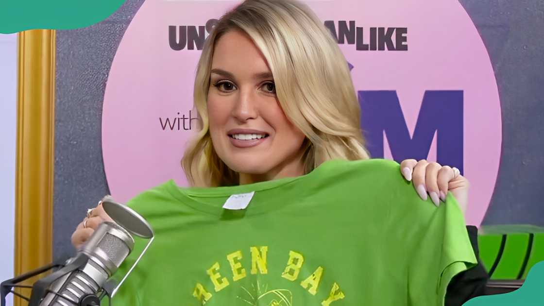 Michelle Smallmon showcasing a bright sports-themed shirt. Michelle Smallmon showcasing a bright sports-themed shirt.