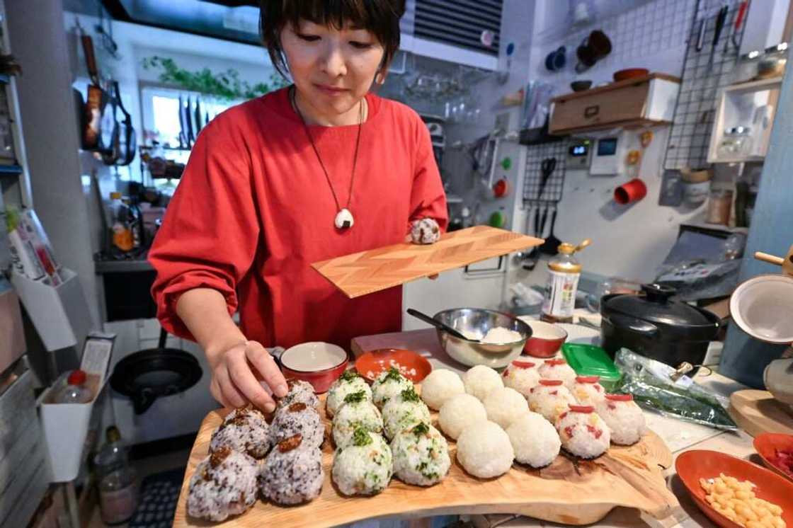 Miki Yamada prepares onigiri rice balls for her catering business at home in Tokyo