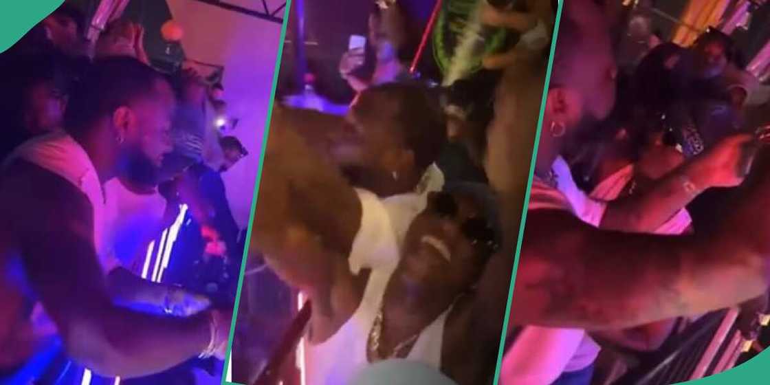 Photos of Wizkid slapping fan while Davido was spraying dollars goes viral Photos of Wizkid slapping fan while Davido was spraying dollars goes viral