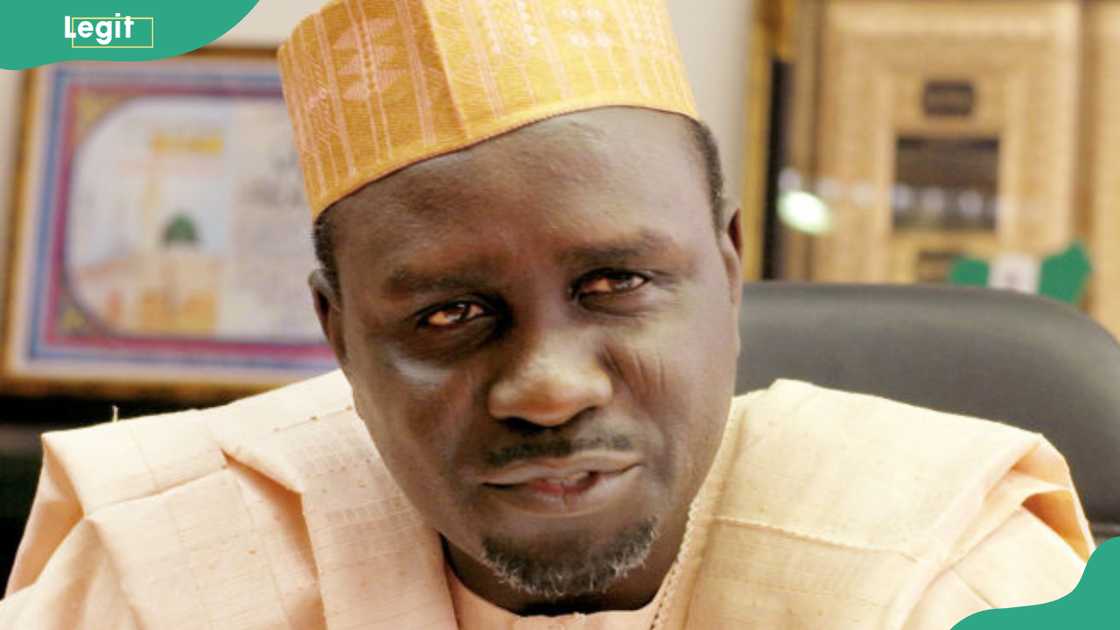 Ibrahim Shekarau in a cream kaftan and embroidered cap, looking at the camera with a slight smile in his office in Kano, 2004