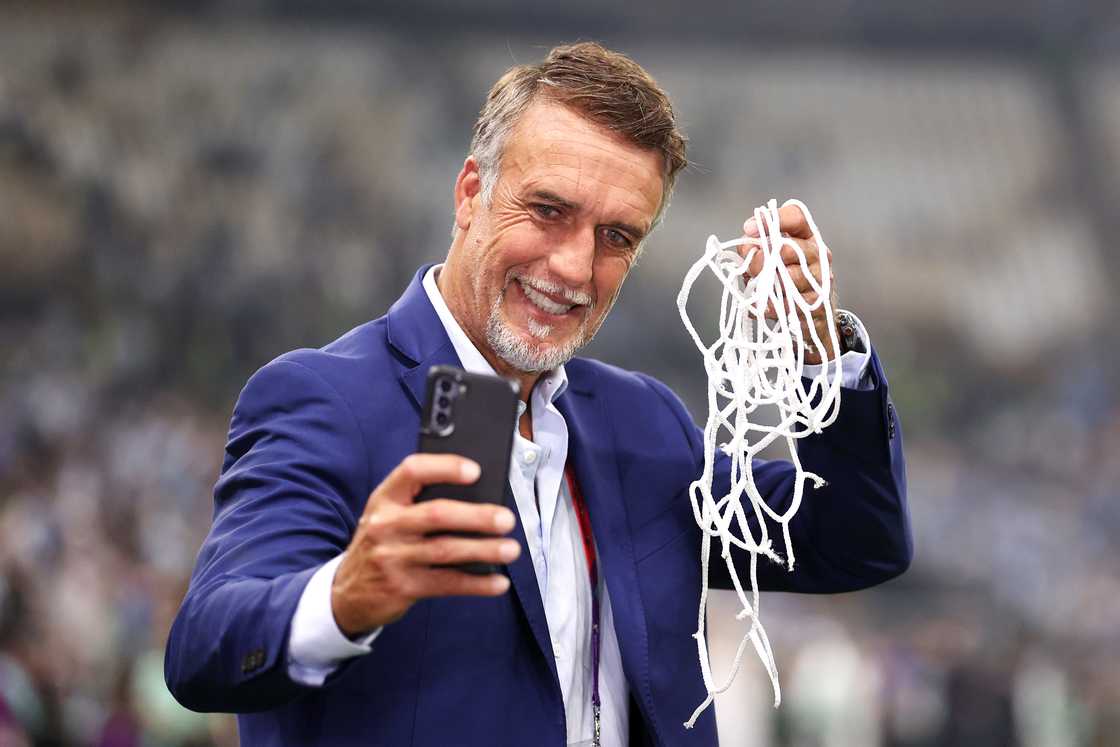 Gabriel Batistuta takes a selfie with cut net