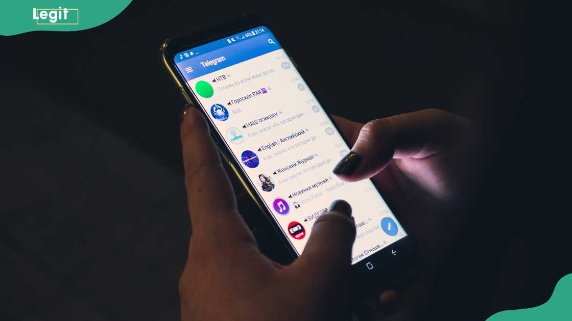 A person using Telegram on a smartphone