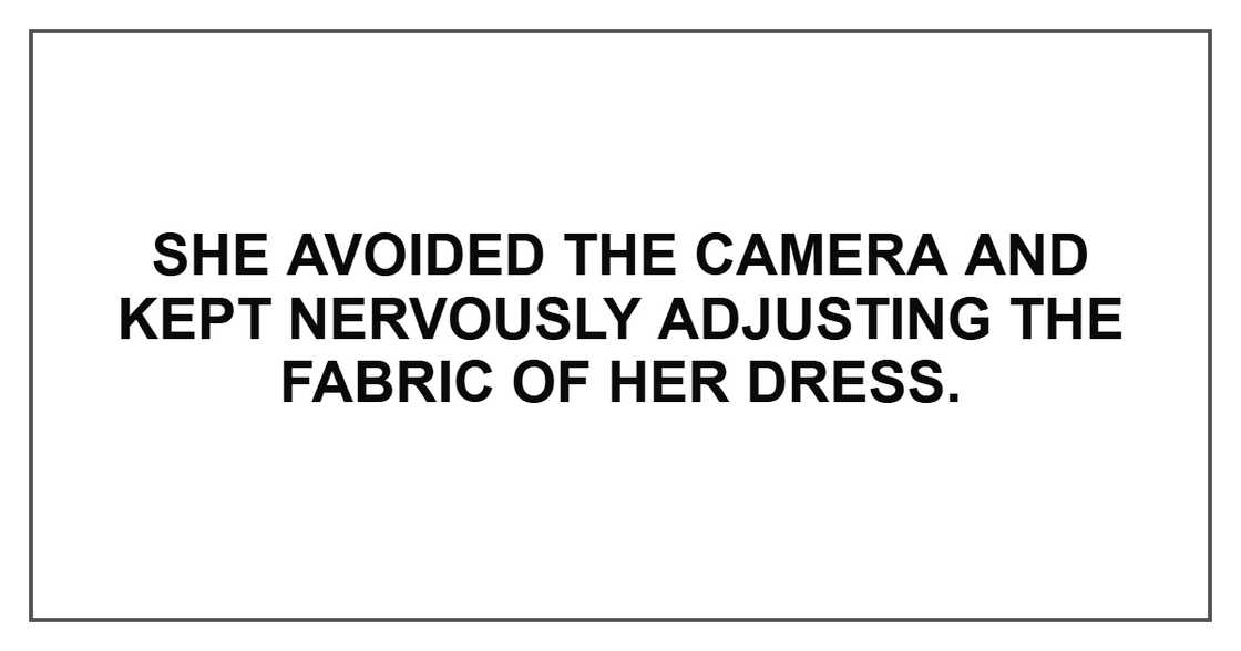 She avoided the camera and kept nervously adjusting the fabric of her dress.