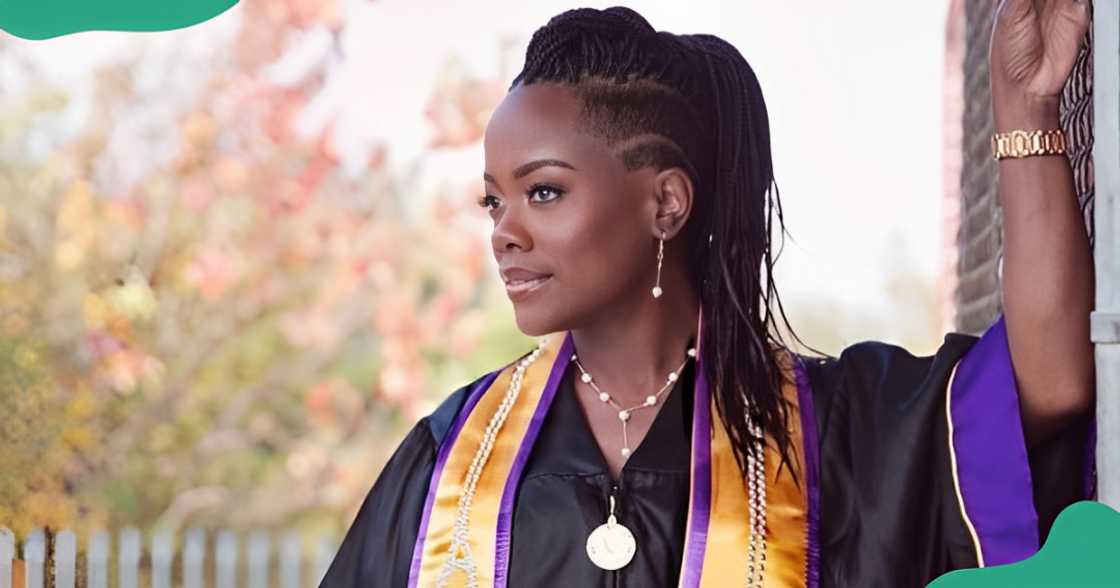 A college students poses in a graduation gown. A college students poses in a graduation gown.